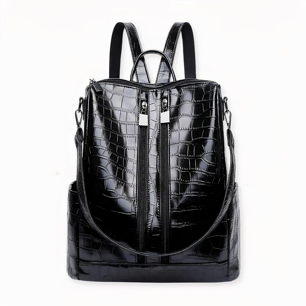 Entdecken Sie diesen Rucksack im urbanen Stil, der Sie mit seiner Zweckmäßigkeit und seinem eleganten Stil begeistern wird. Er ist aus Kunstleder mit Krokodilprägung gefertigt und verleiht Ihrem Outfit einen modischen Touch. Dank seines Fassungsvermögens können Sie immer Ihren täglichen Bedarf mit sich führen.
