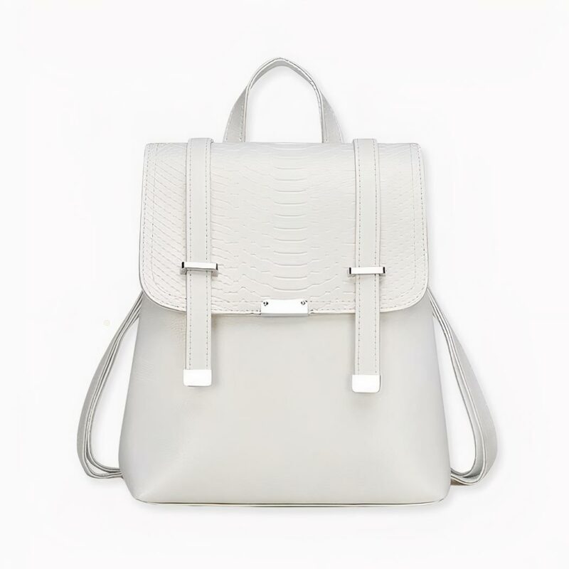 Vintage-Rucksack mit Schuppenmuster in weißer Ausführung auf hellgrauem Hintergrund.