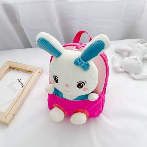 Schulrucksäcke aus Kaninchenplüsch für Kinder rosa mit einem weißen Bett