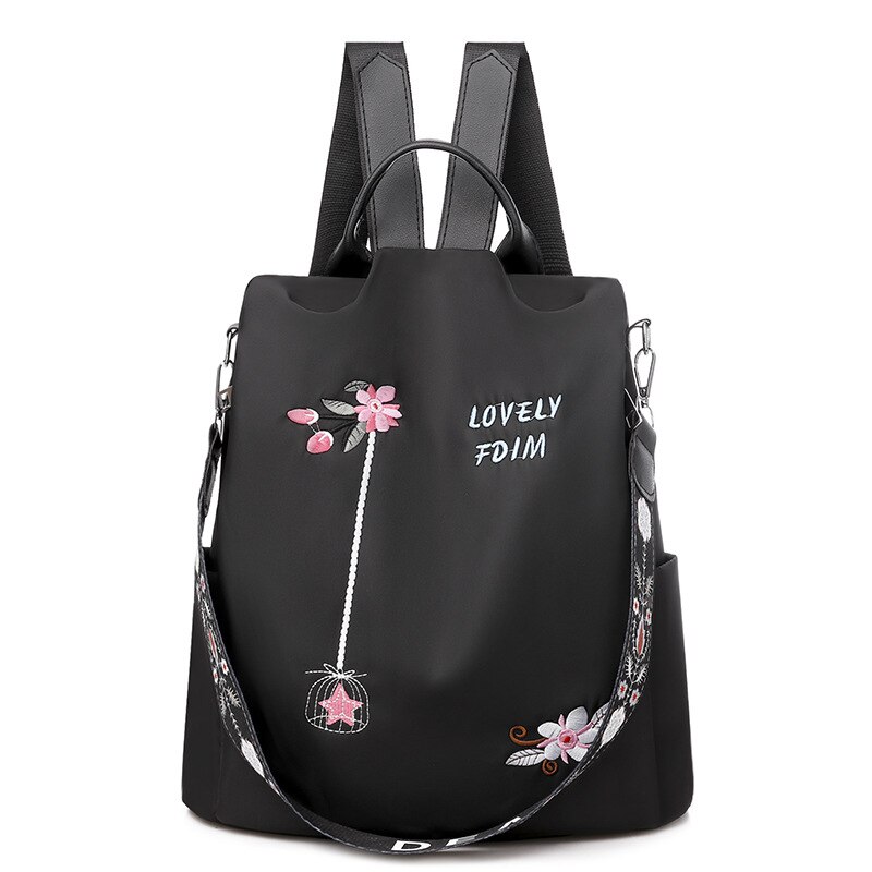 Blumenbestickter Rucksack für Frauen schwarz mit weißem Hintergrund